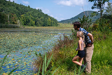 A girl and her father admiring some wetlands. Link to Life Stage Gift Planner Under Age 45 Situations. A girl and her father admiring some wetlands. Link to Life Stage Gift Planner Under Age 45 Situations.